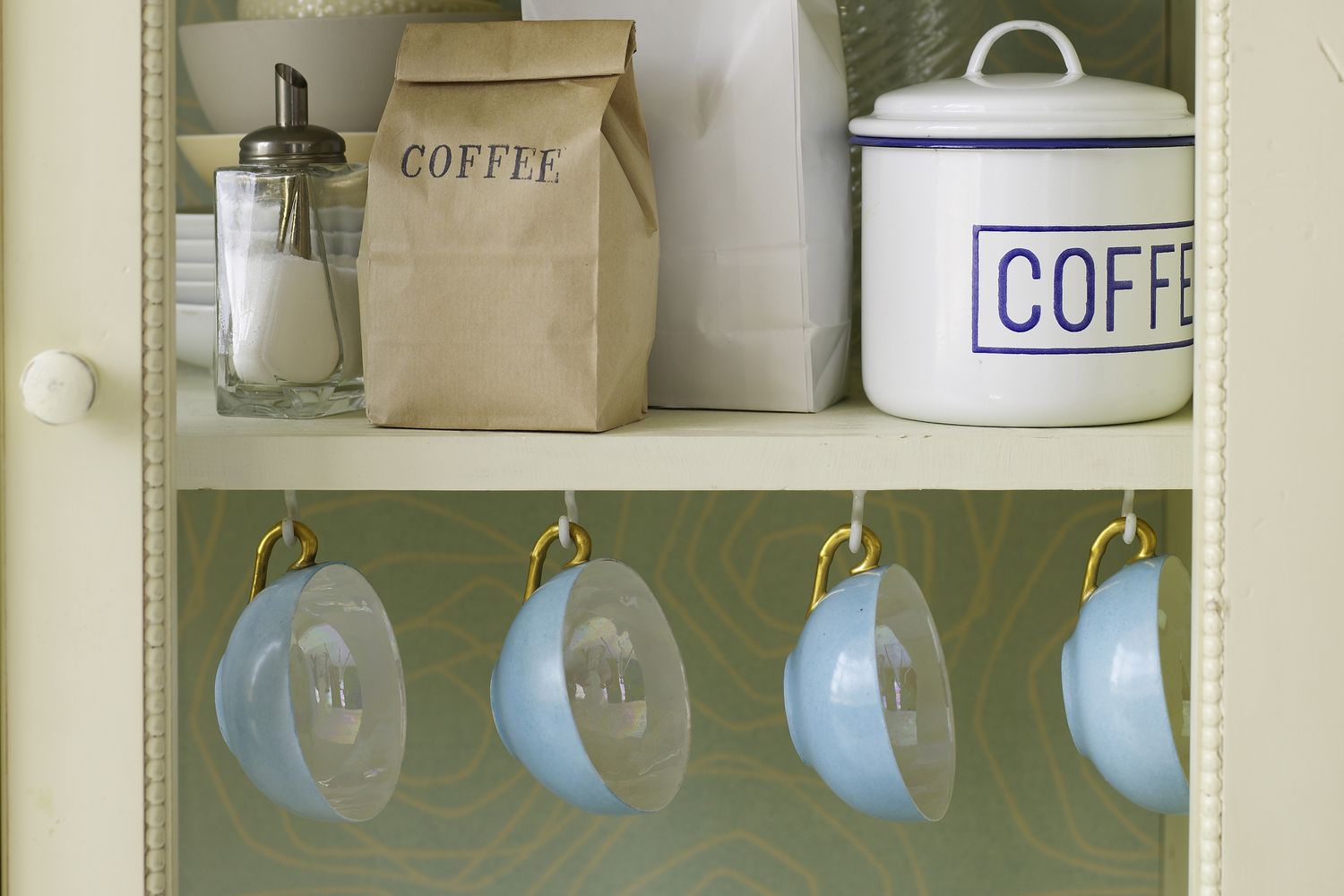 coffee cups hanging from hooks