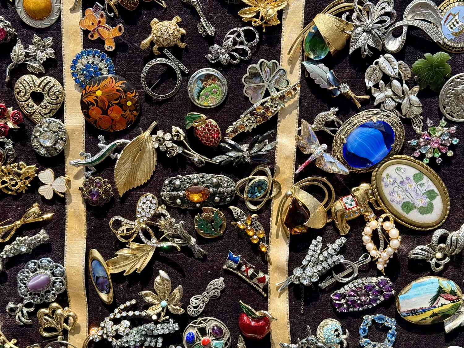Collection of decorative pins and brooches on display