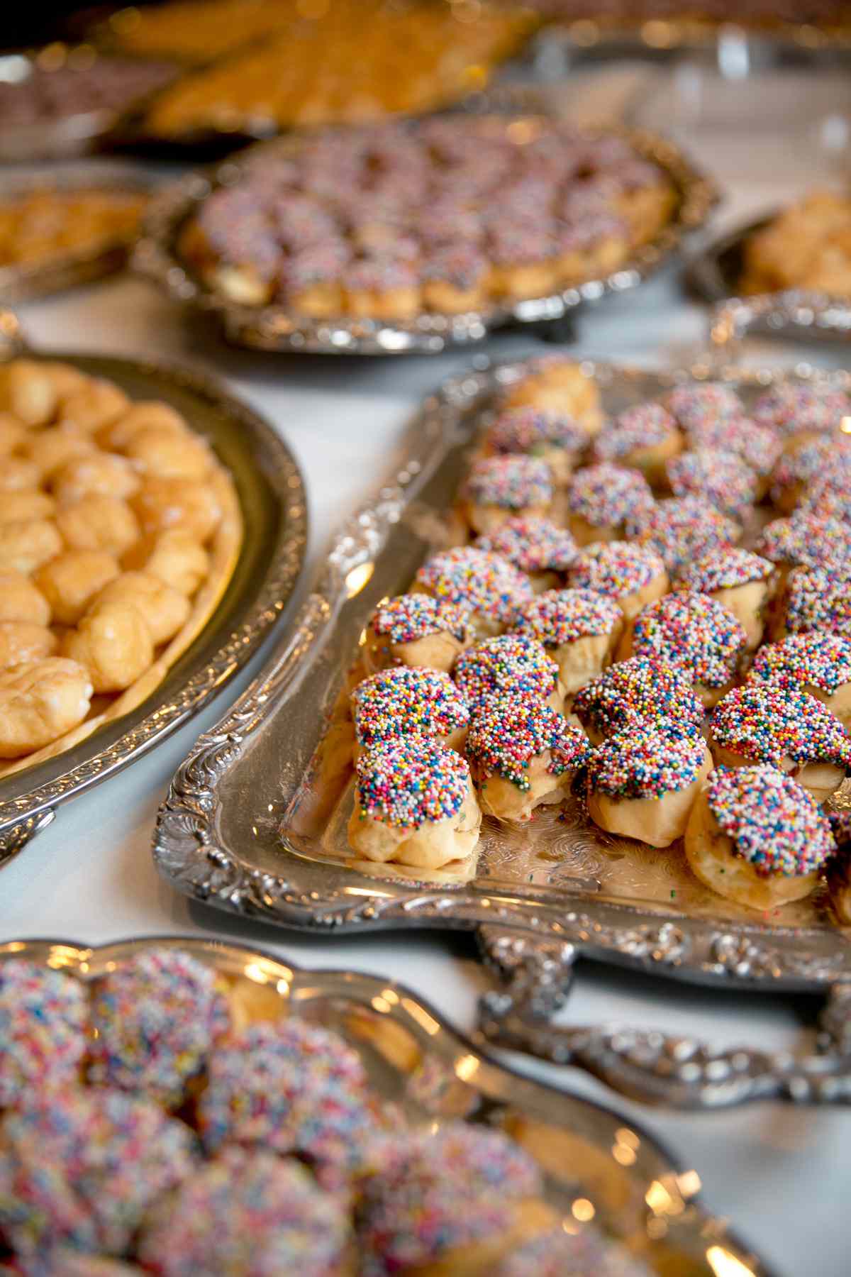 sprinkled desserts on silver platters