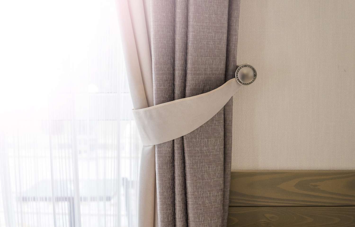 Curtain against window with a warm sunlight.