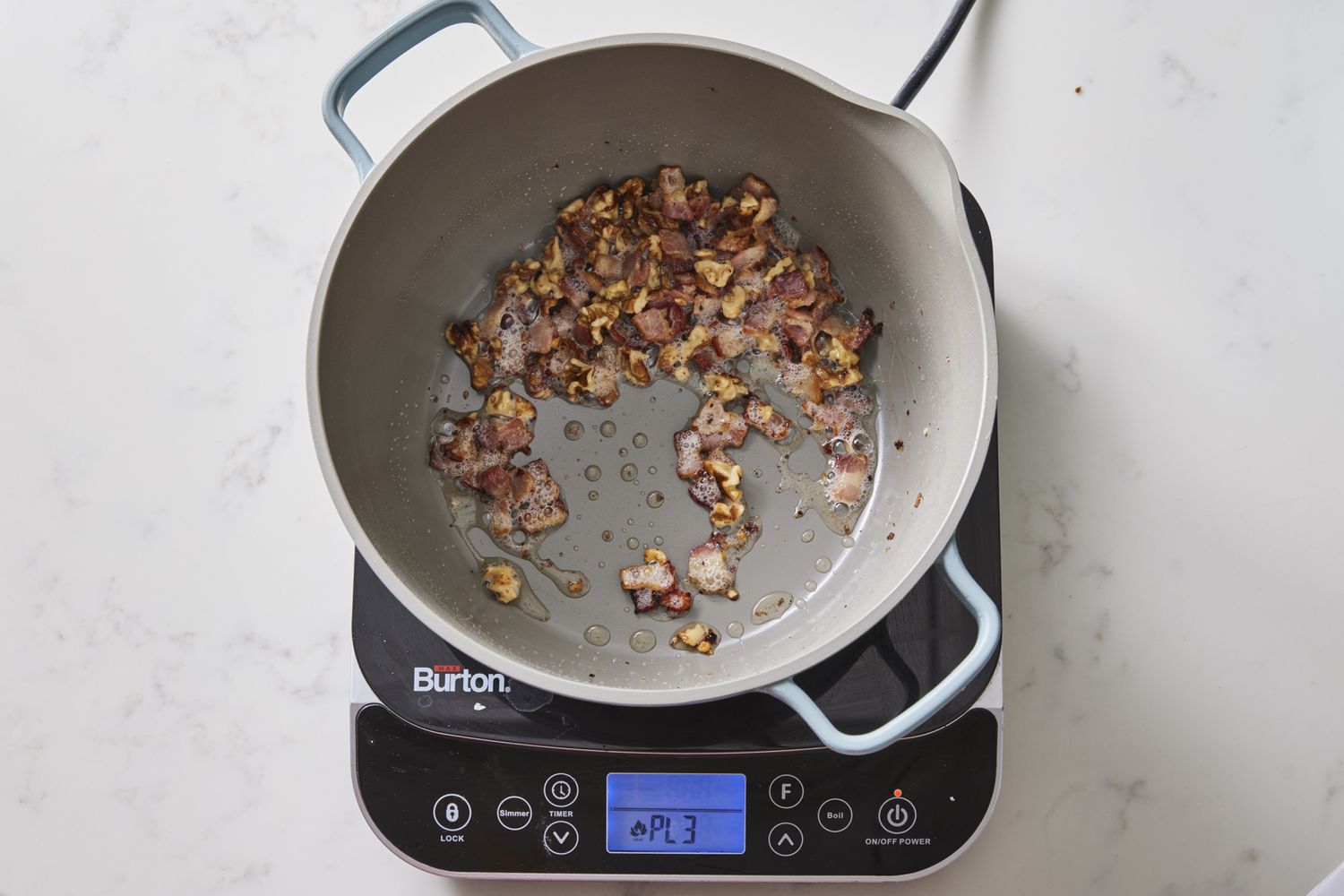 Walnuts toasting in pot