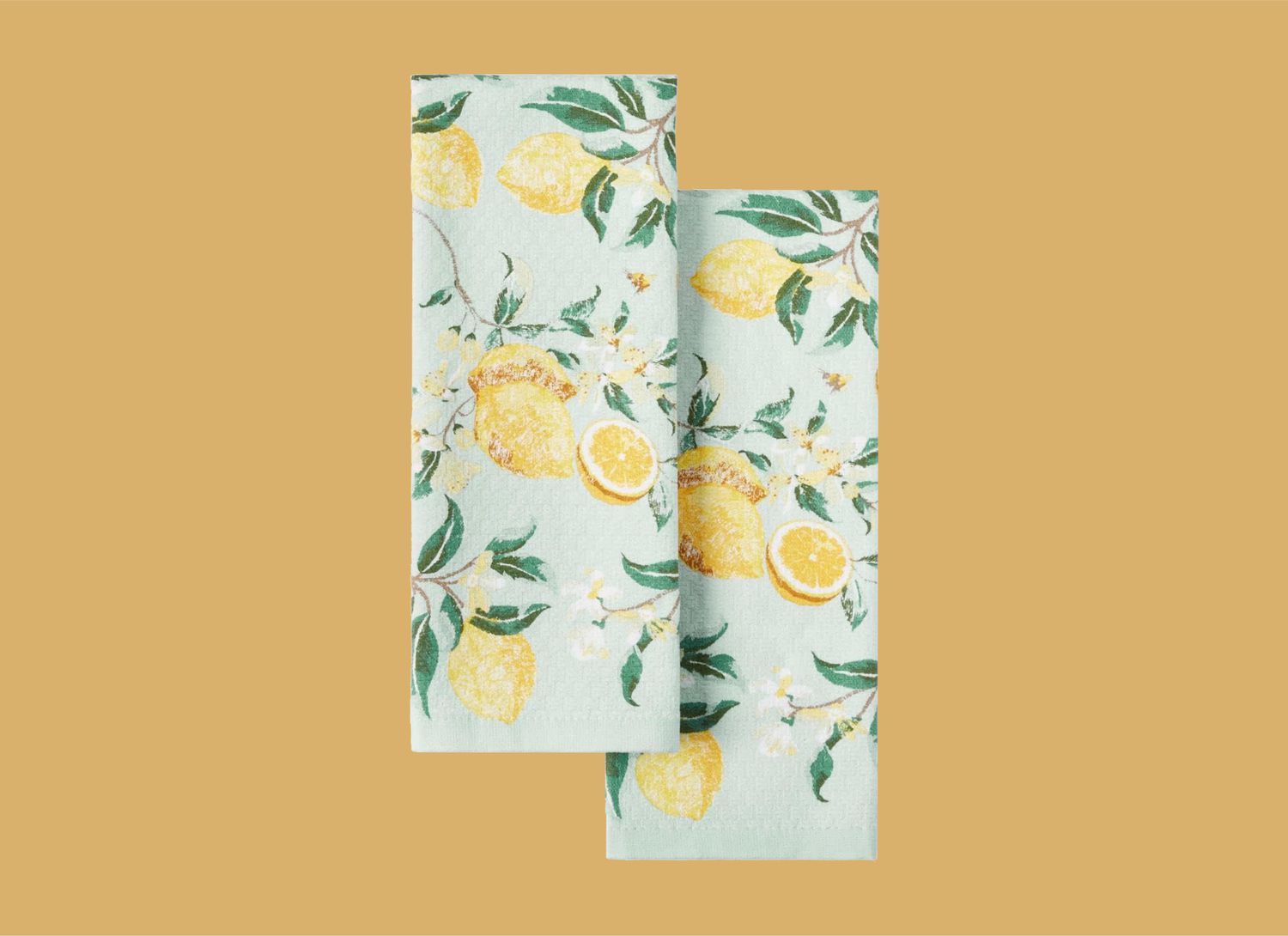 two dishtowels with lemon print on yellow background