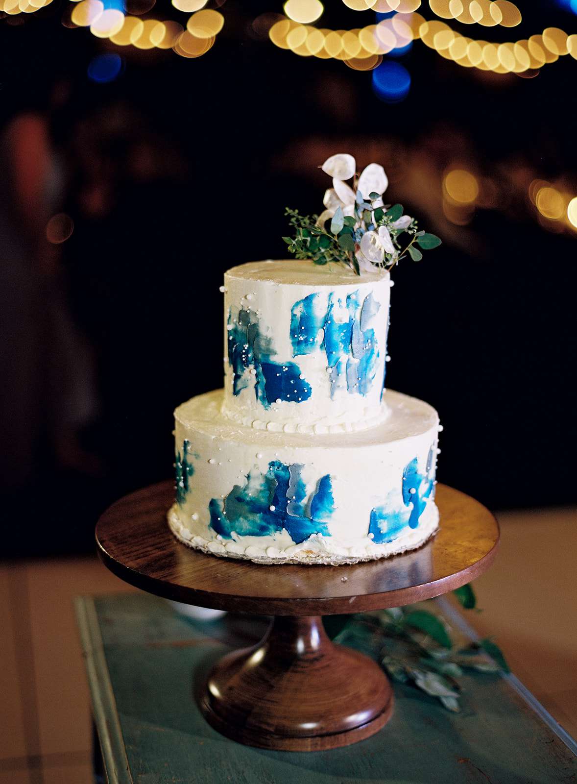 two tier white and blue frosted wedding cake