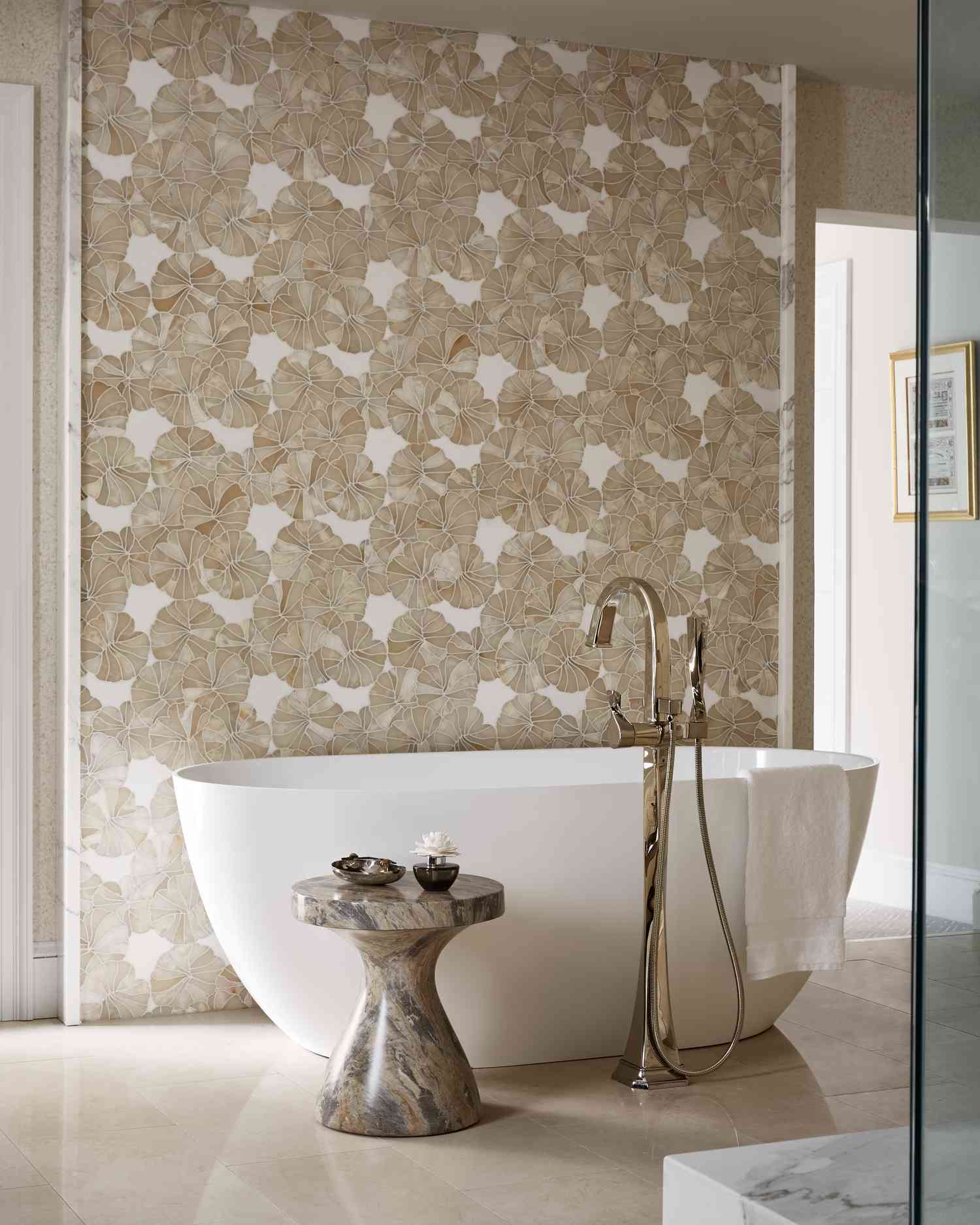 a bathroom with floral neutral tiles