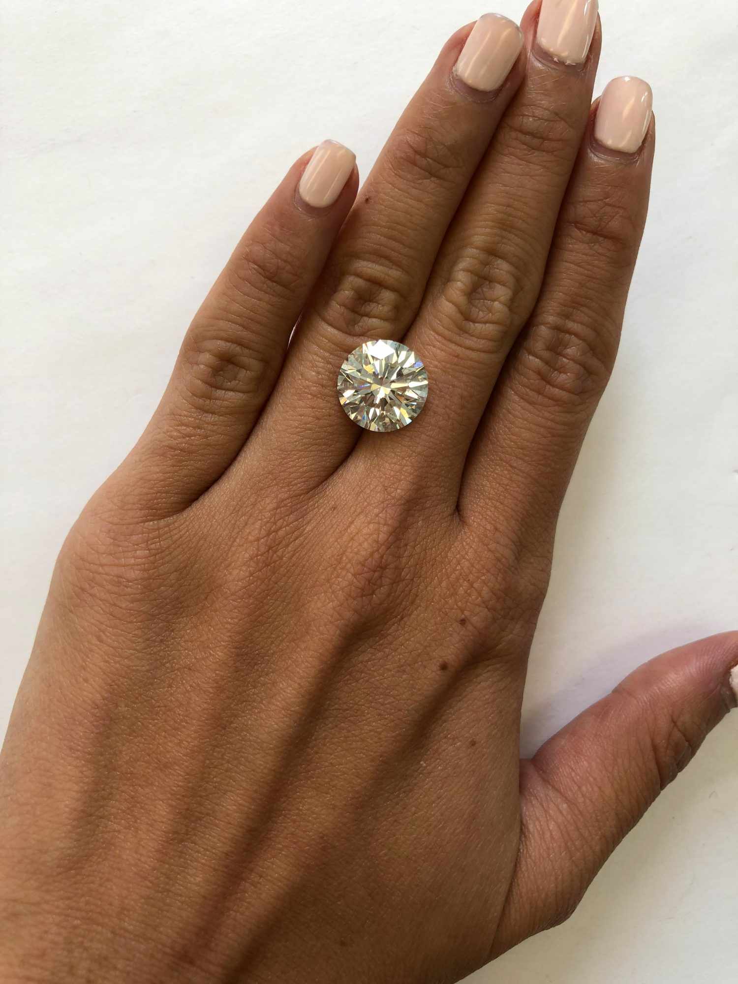 hand with 8 carat diamond