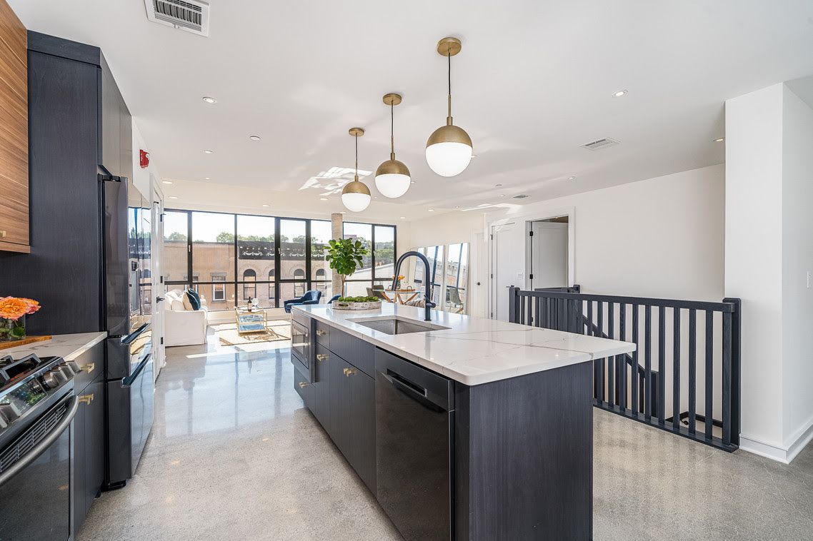 Dark gray kitchen with concrete floors