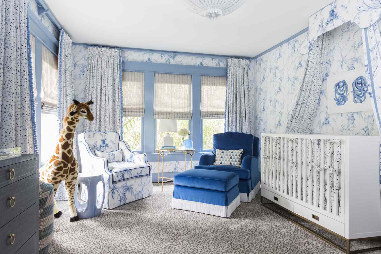 whimsical blue kid's nursery with giraffe toy