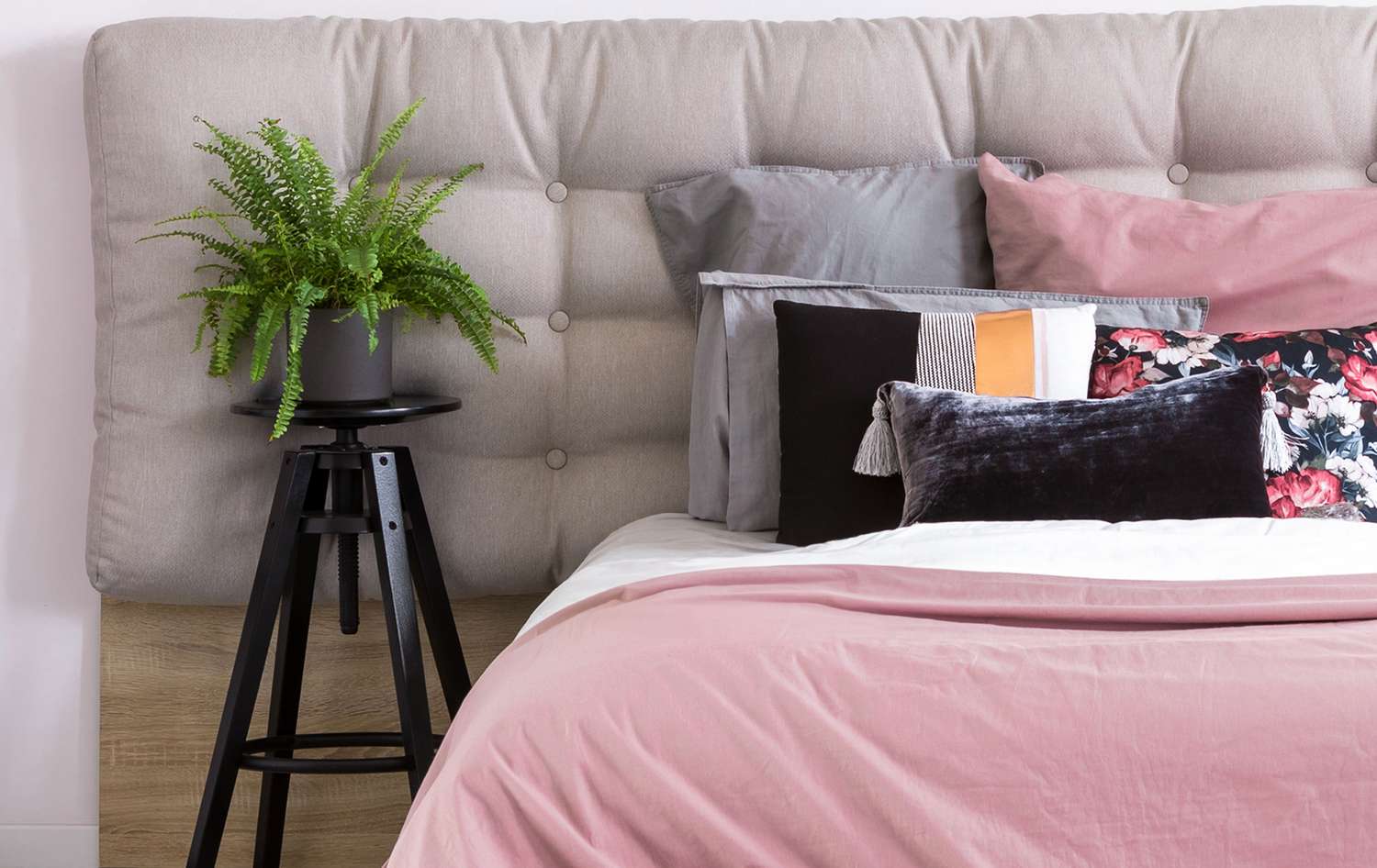 Bedroom set up with boston fern plant