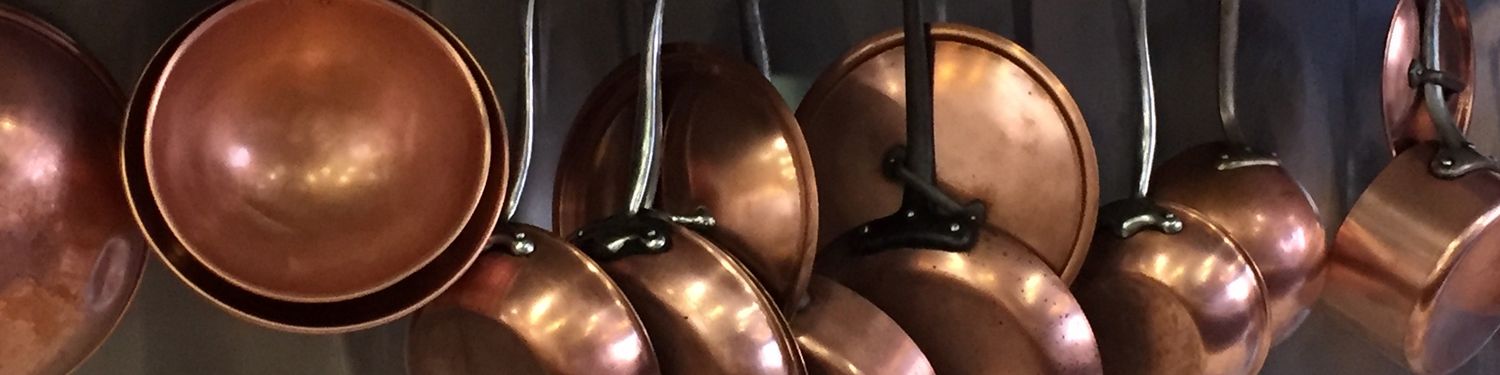 Copper pots hanging in a kitchen