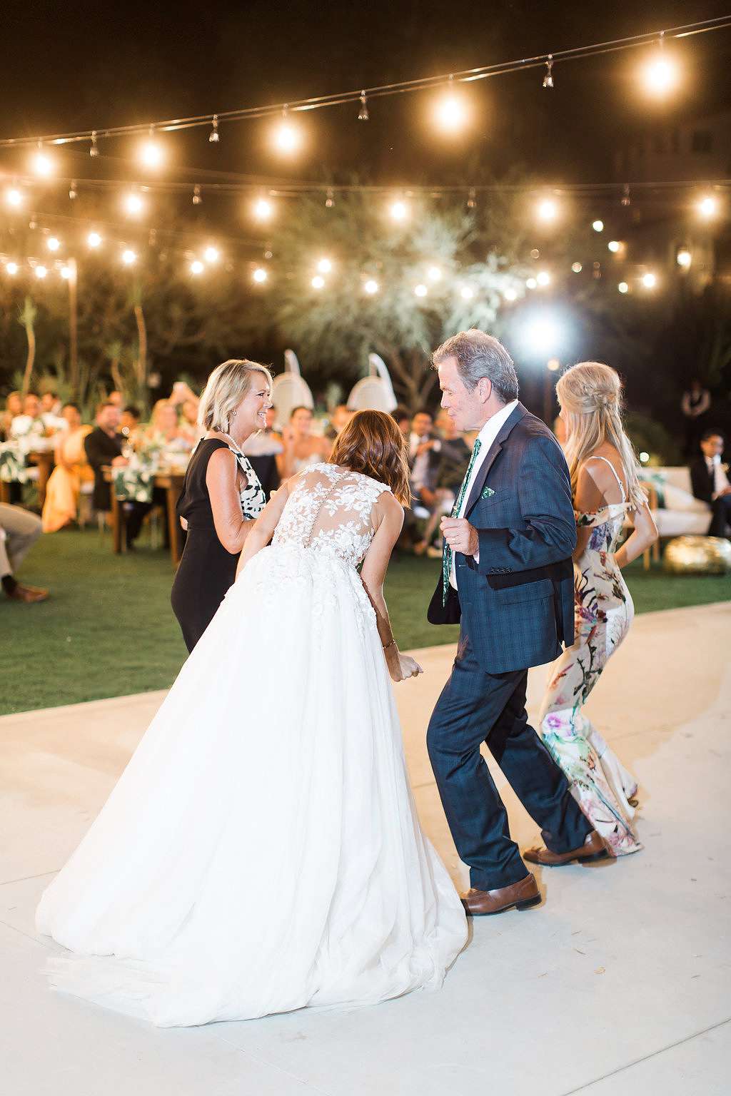 emily adhir wedding couple dancing with family