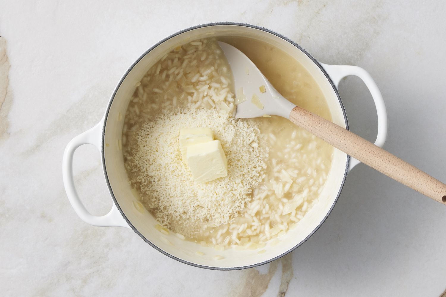 Rice and butter cooking in pot