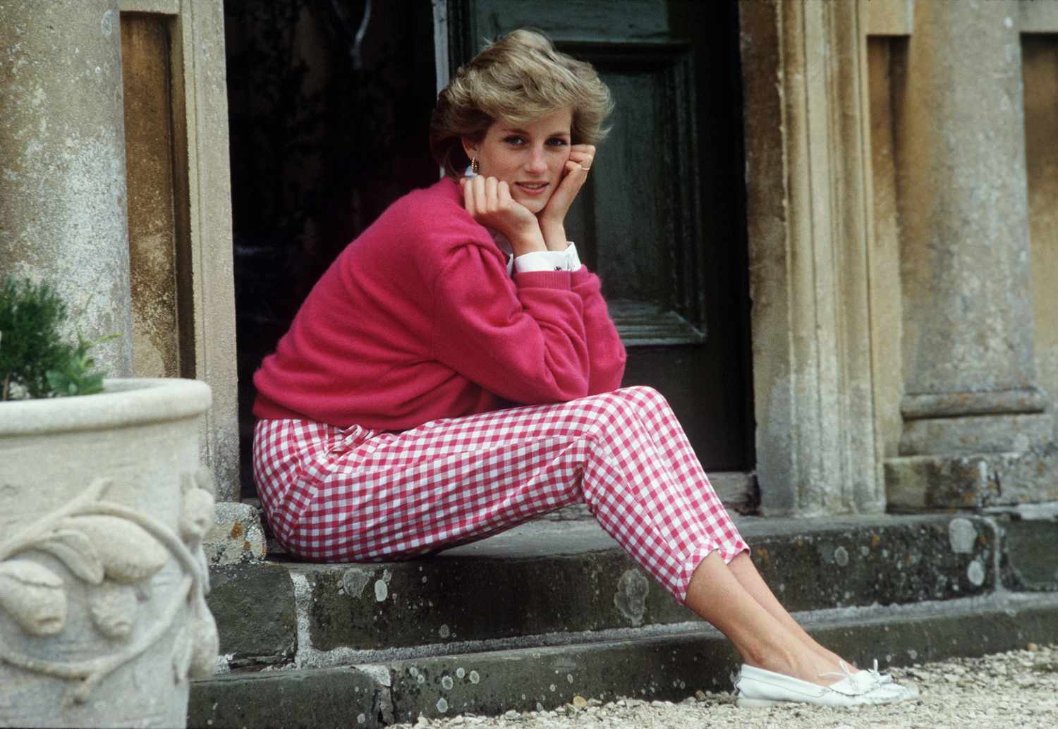 Diana, Princess of Wales, sitting outside a building on stairs