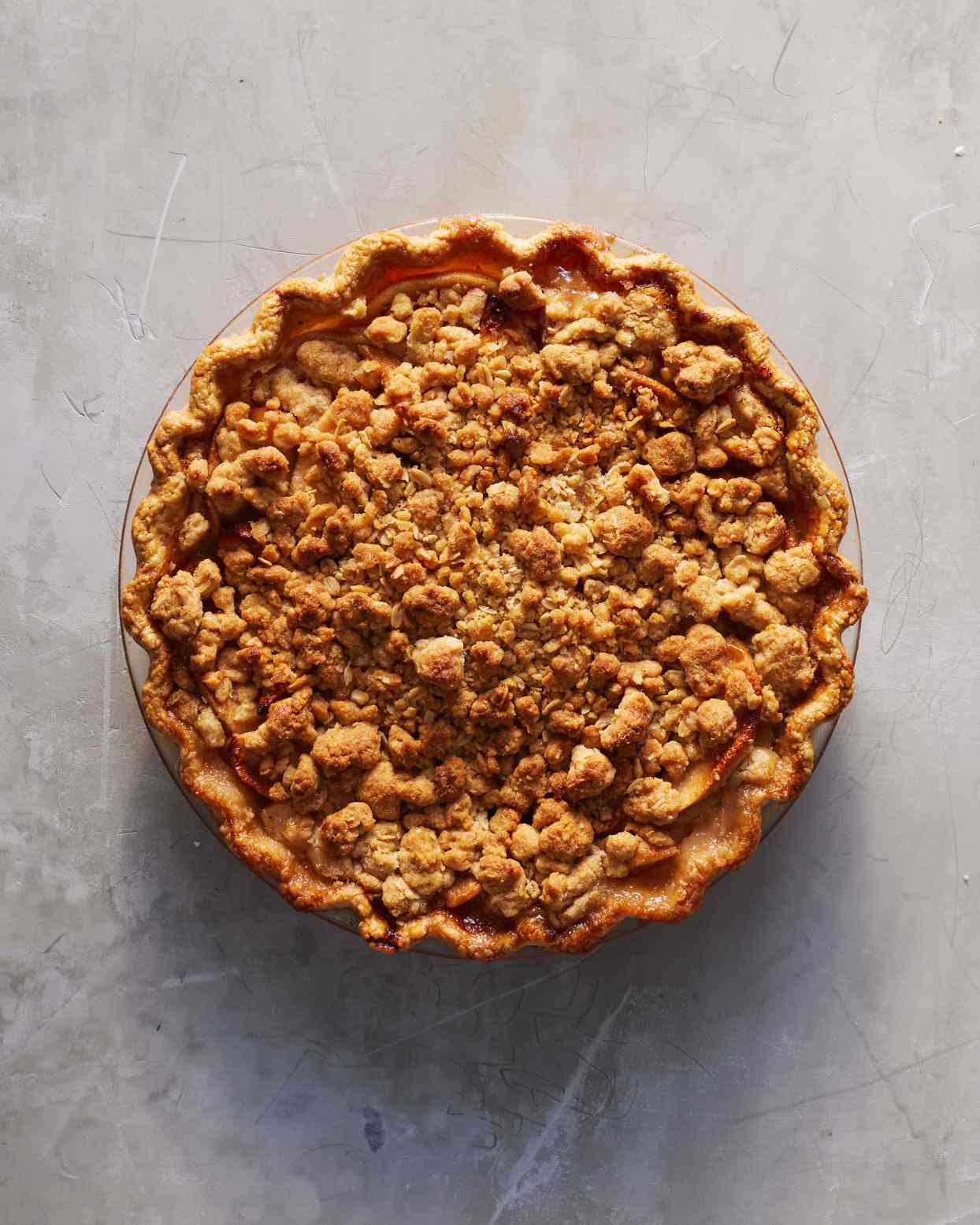 apple crumble pie on gray countertop