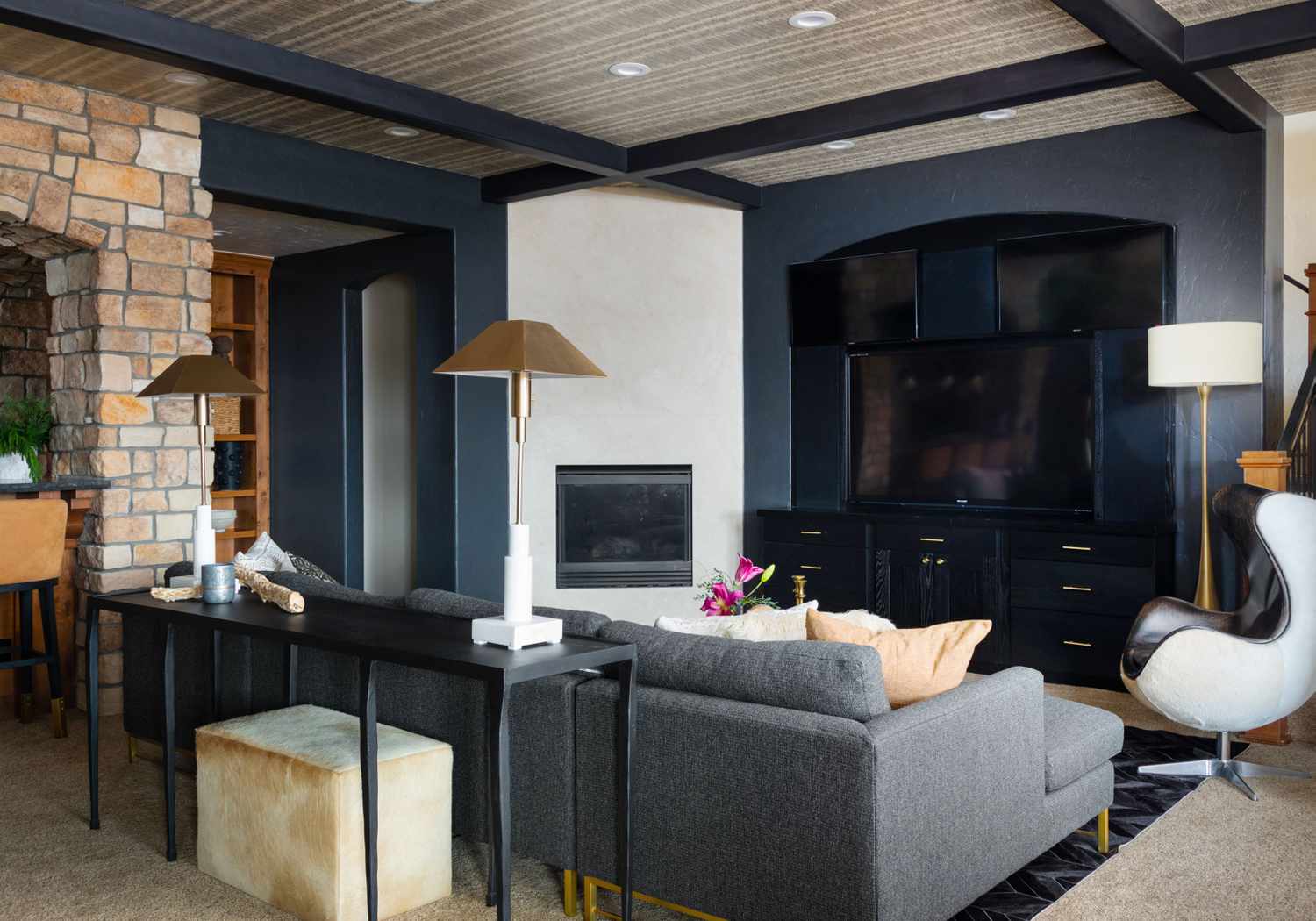 Living room with multiple tvs