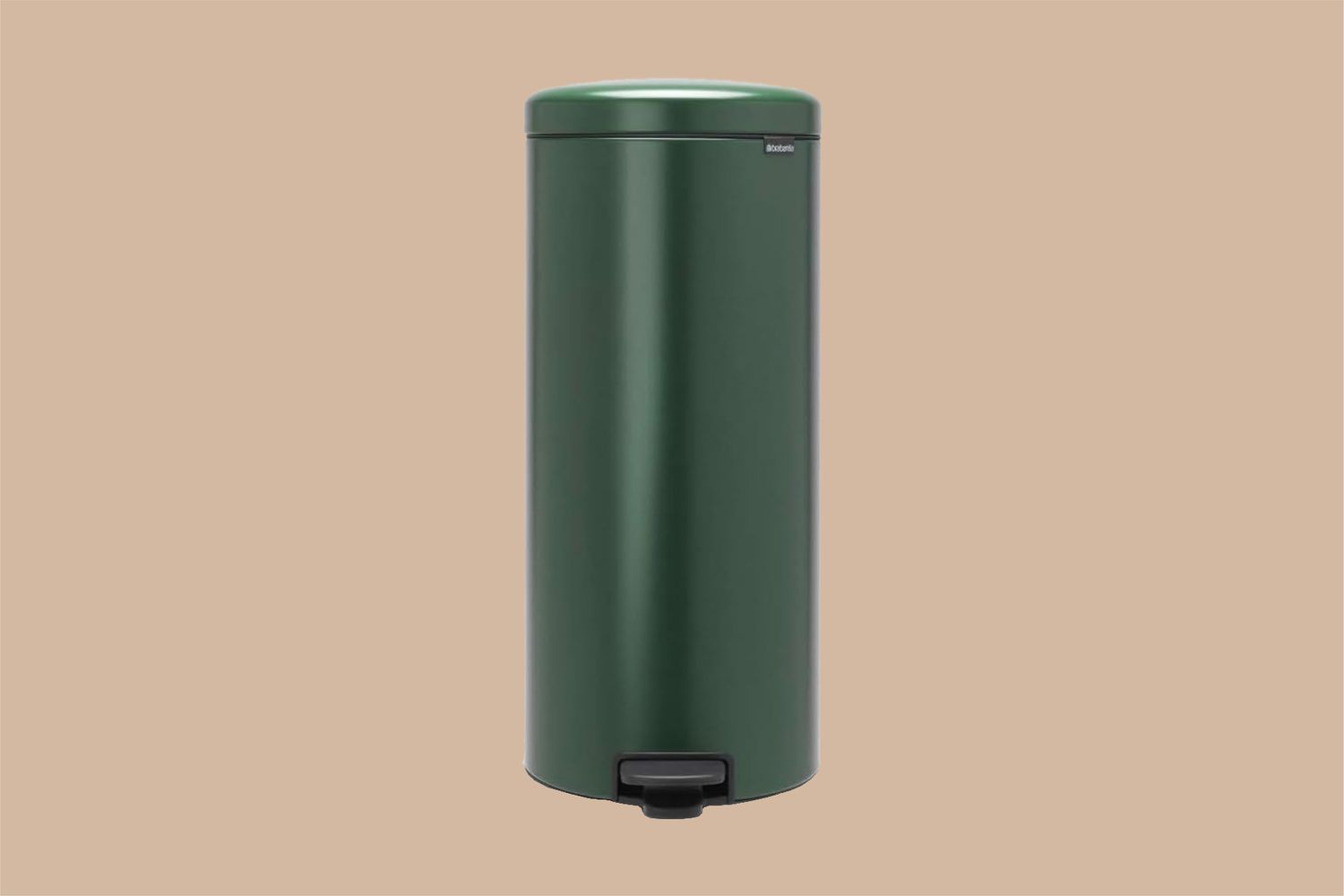 dark green trash can on tan background