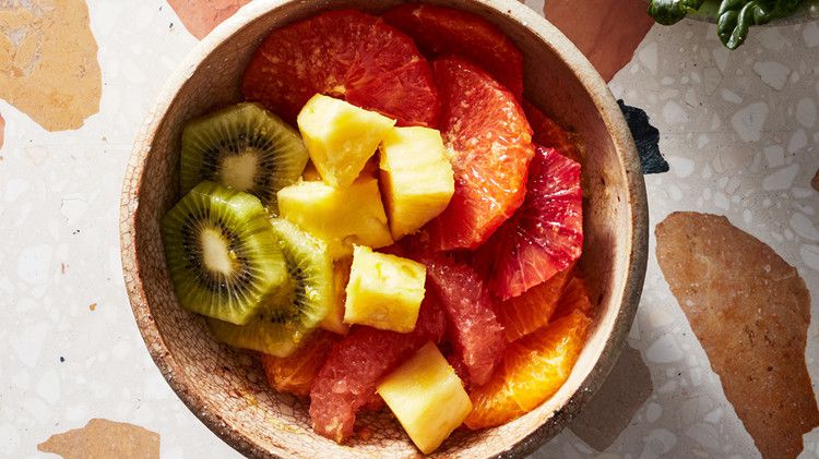 tropical fruit juice salad with pineapple and kiwi