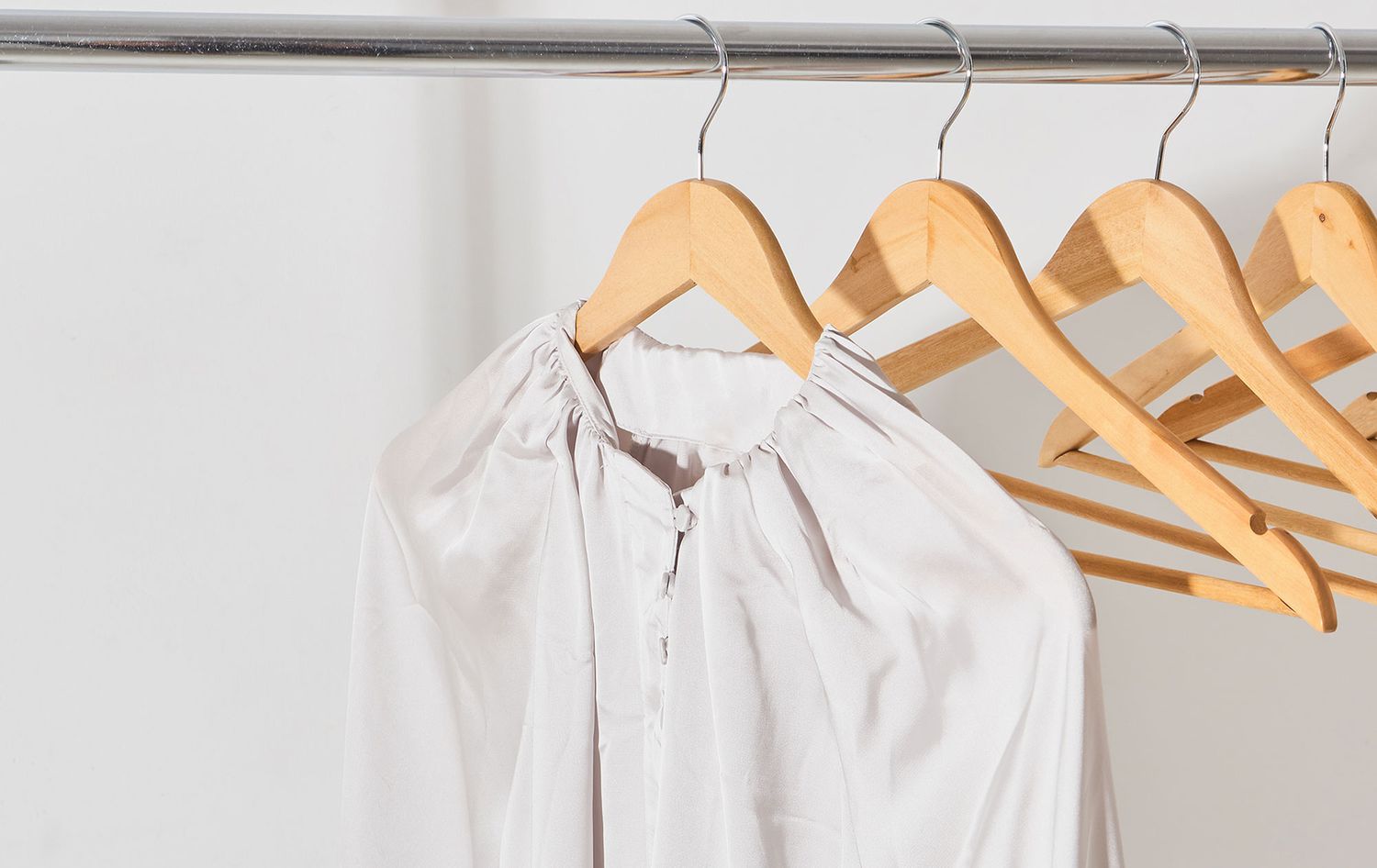 Silk top hanging from hanger