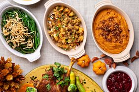 Traditional Thanksgiving sides, green beans casserole, stuffing and sweet potatoes. 