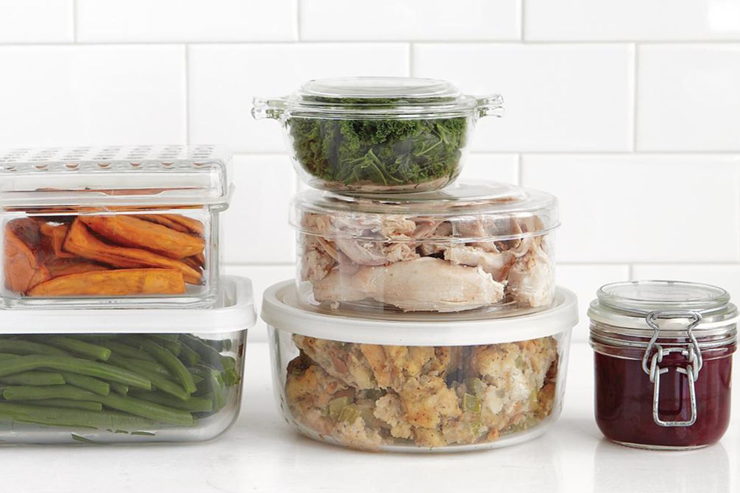 leftovers in glass containers in a white kitchen