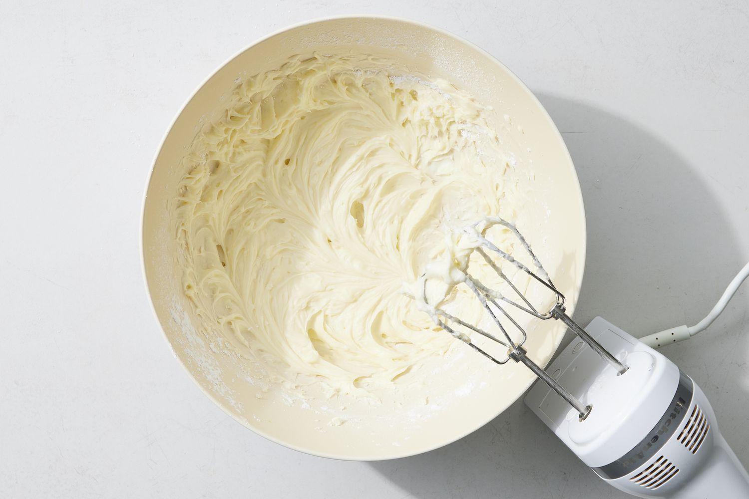 Overhead view of frosting with mixer