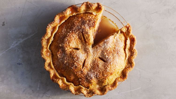 best apple pie sliced on gray countertop
