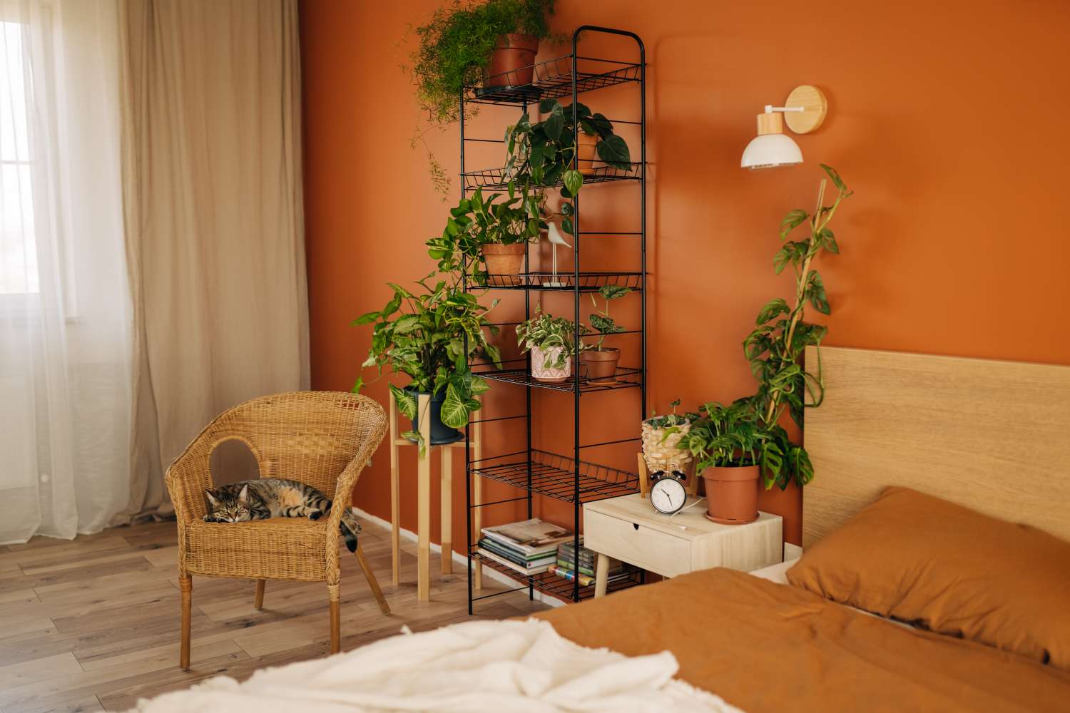 Console table with a lamp by the bed, decor on the wall of crocheting napkins and wreaths, home decoration