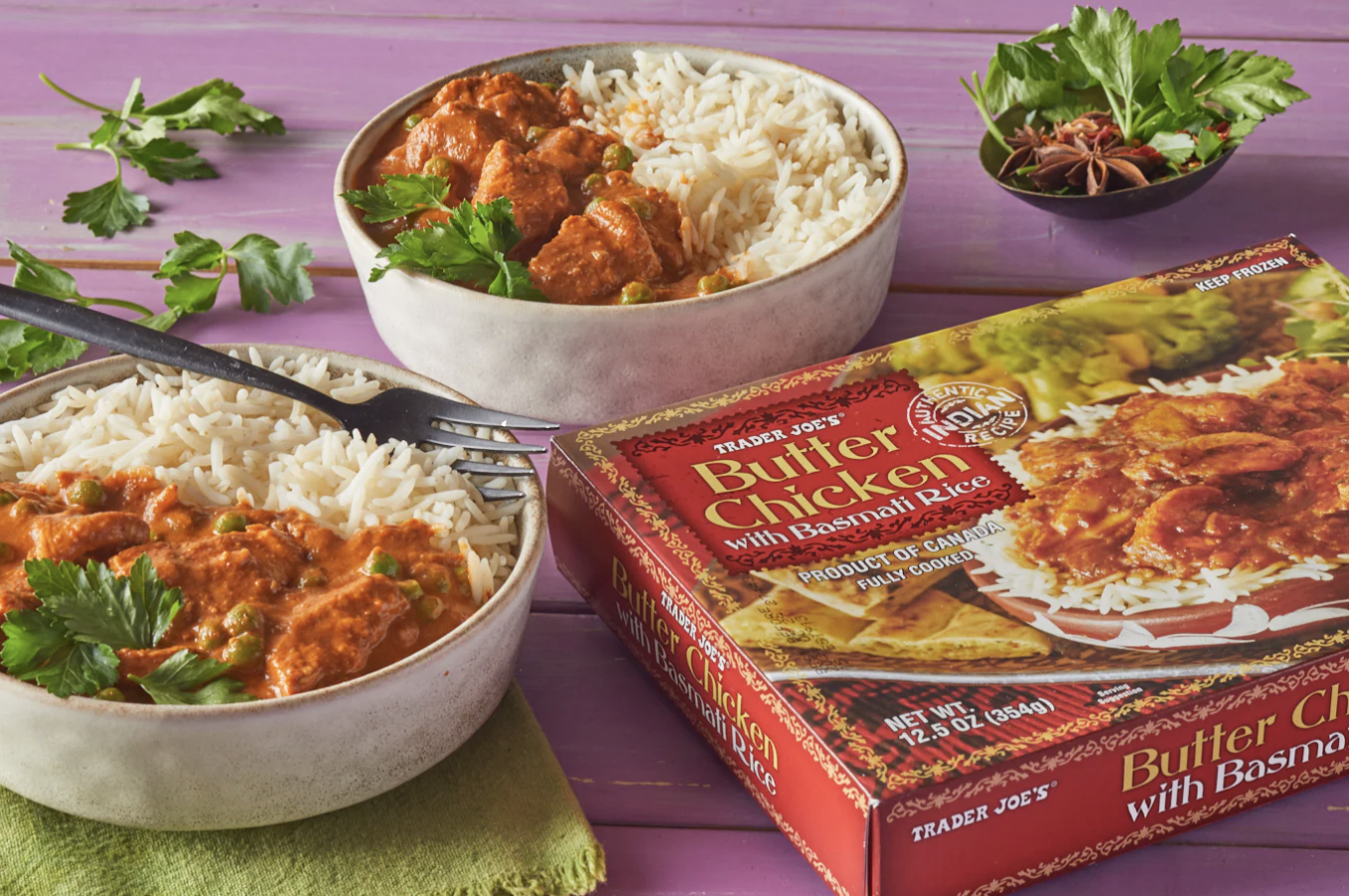 Trader Joes Butter Chicken with Basmati Rice served in bowls with the product packaging displayed