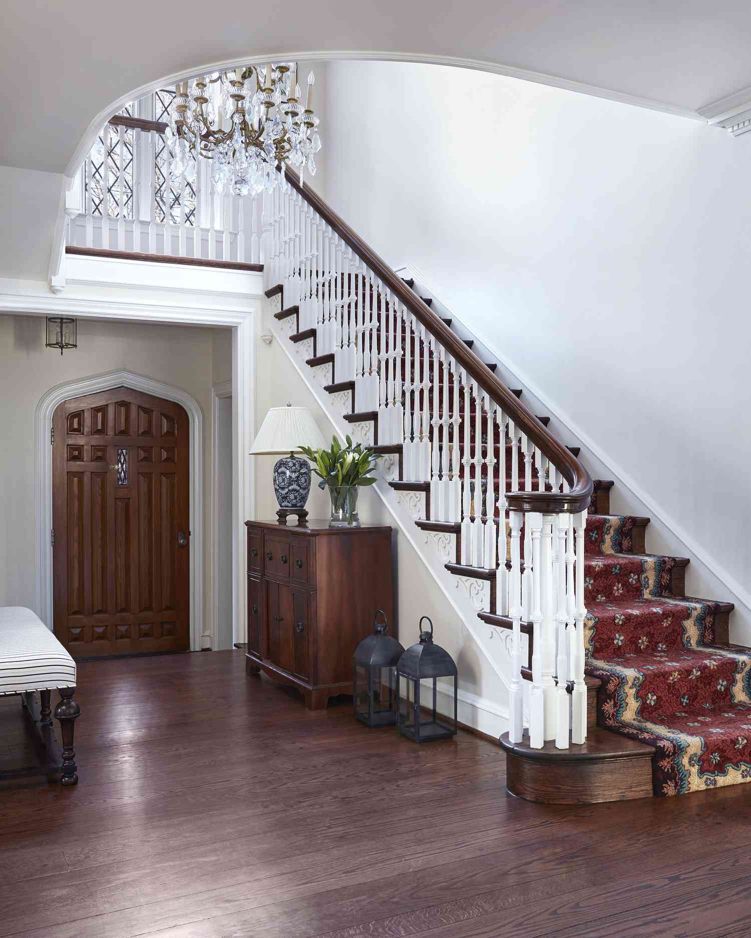 traditional staircase with chandelier