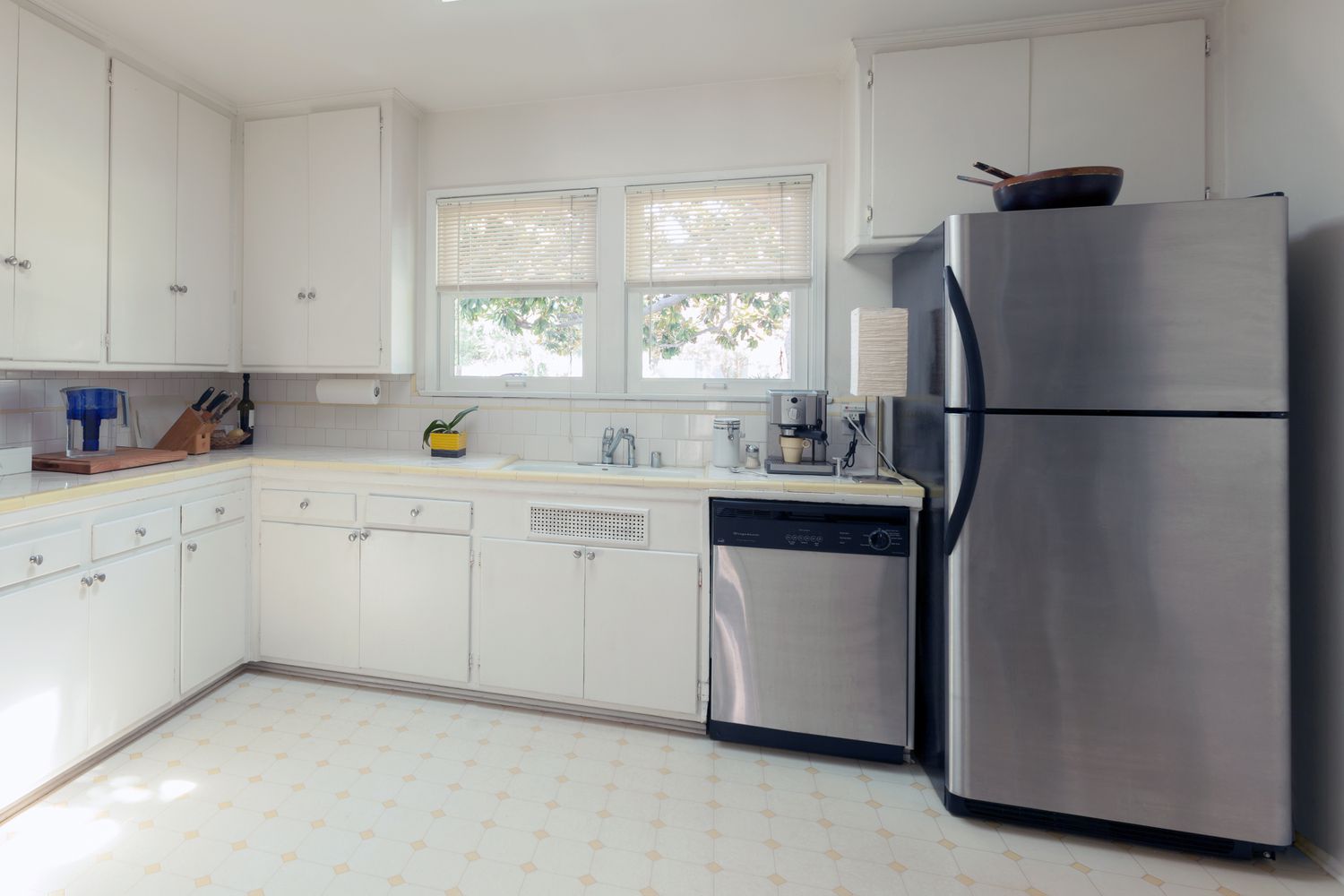 A kitchen with refrigerator freezer combination