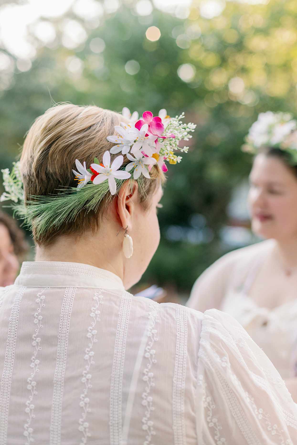 brides wearing flower crowns during ceremony