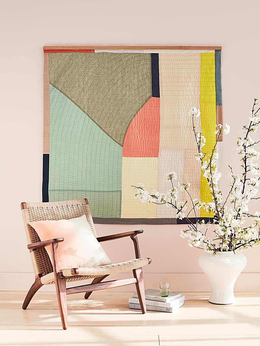 oversized quilt framed on wall