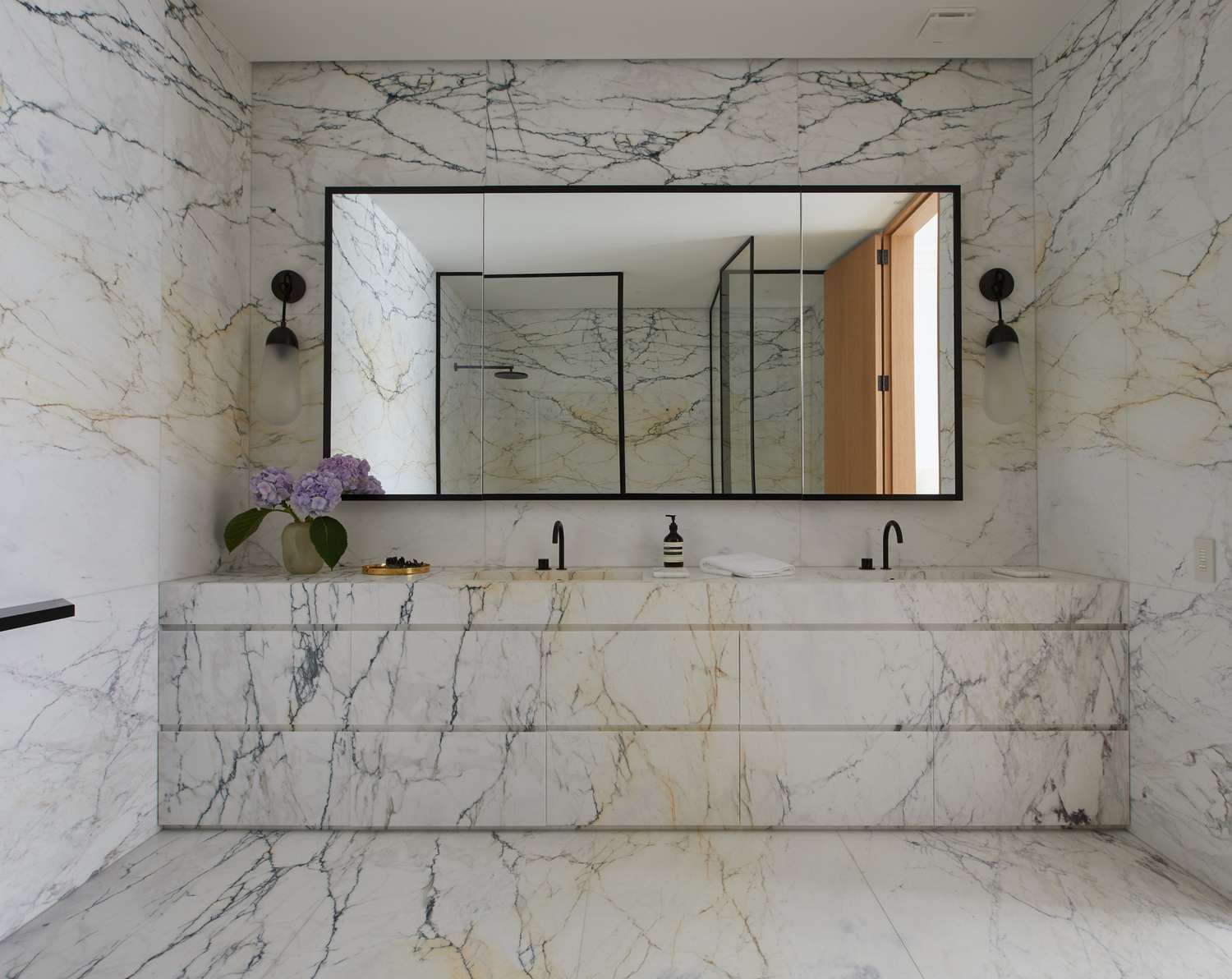white stone bathroom with mirror