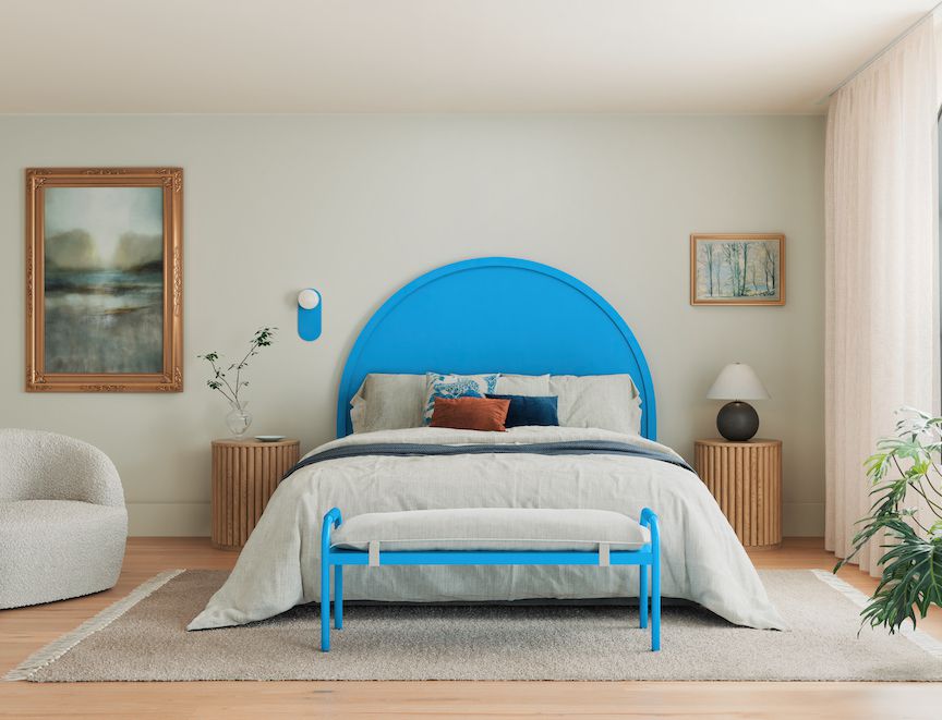 Bed with a blue painted headboard