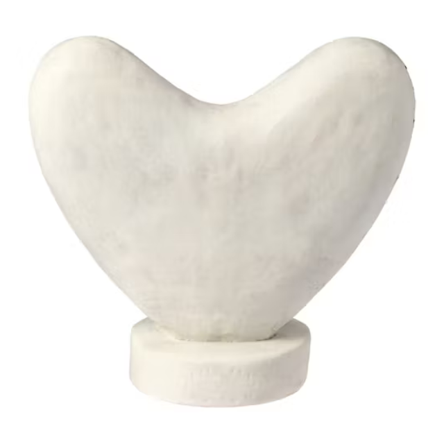 A sculpture in the shape of a heart on a pedestal