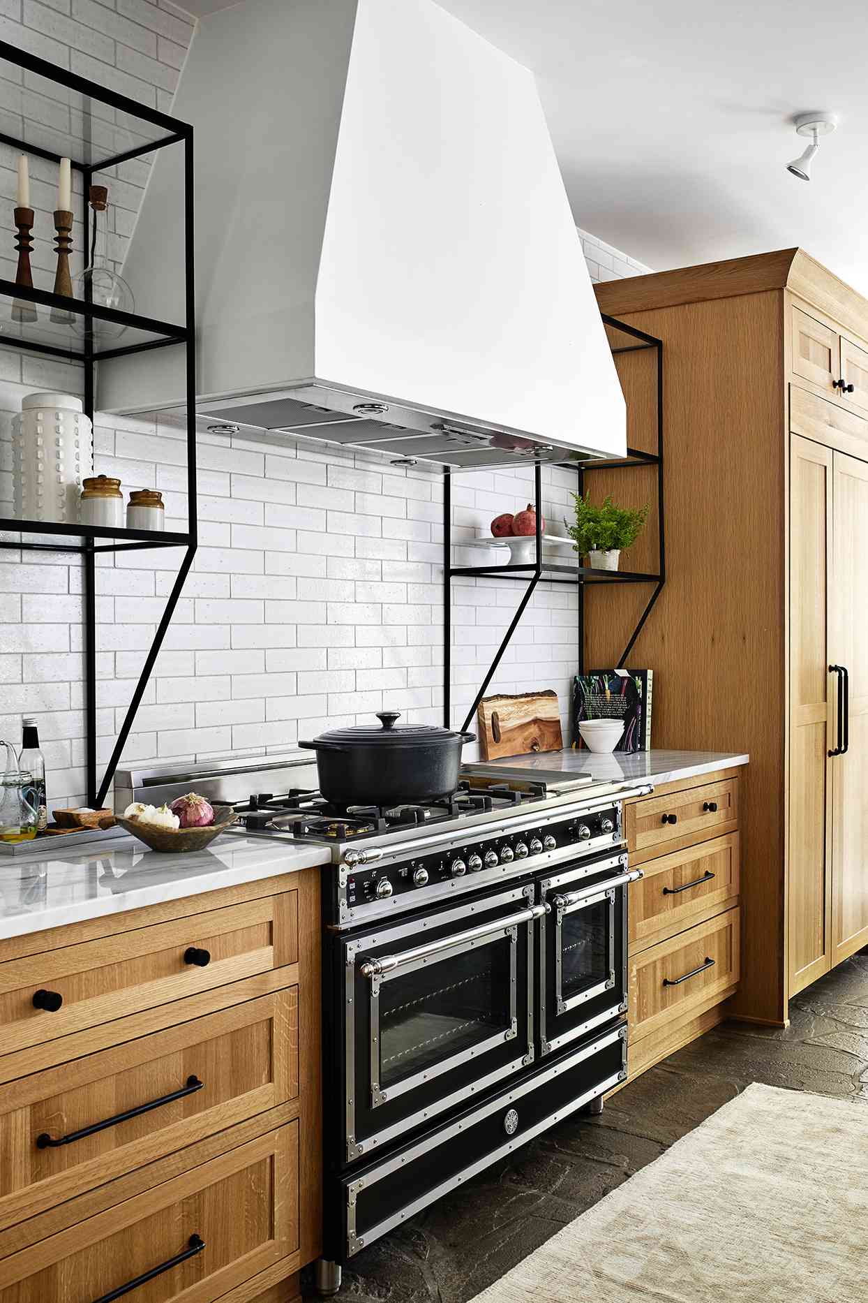 modern black and silver oven and stove in white kitchen