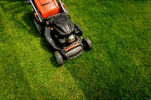 Lawn mower on green grass