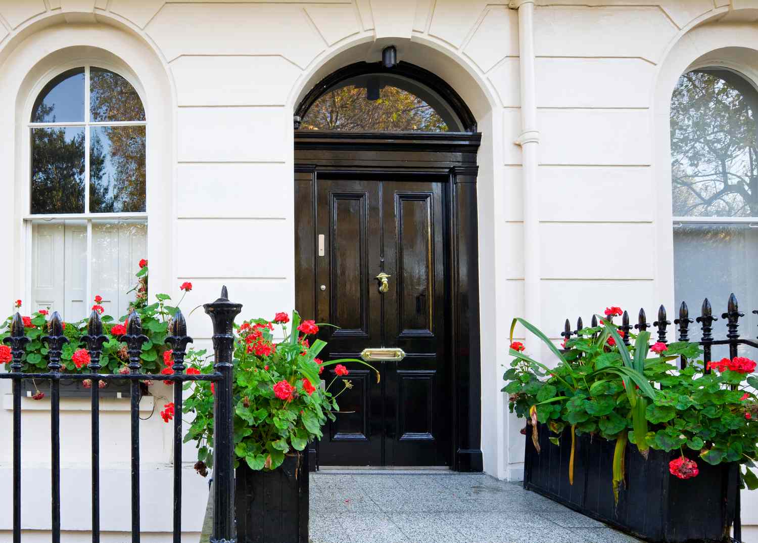 White row house with black door in central London