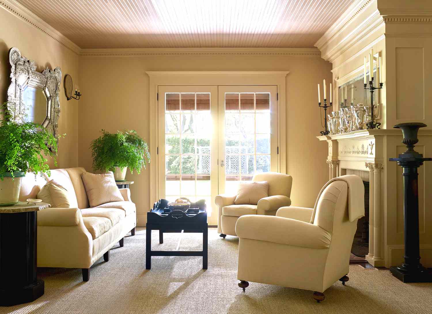 butter yellow living room near French doors