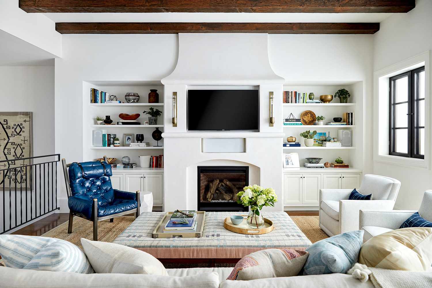 Living room with fireplace, couch and chair seating