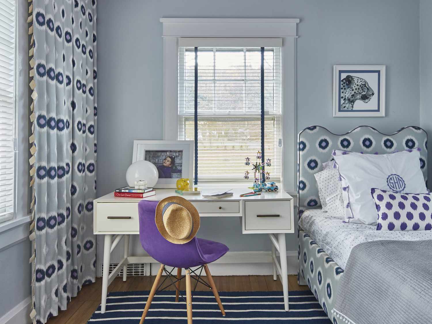 Small bedroom with purple patterns