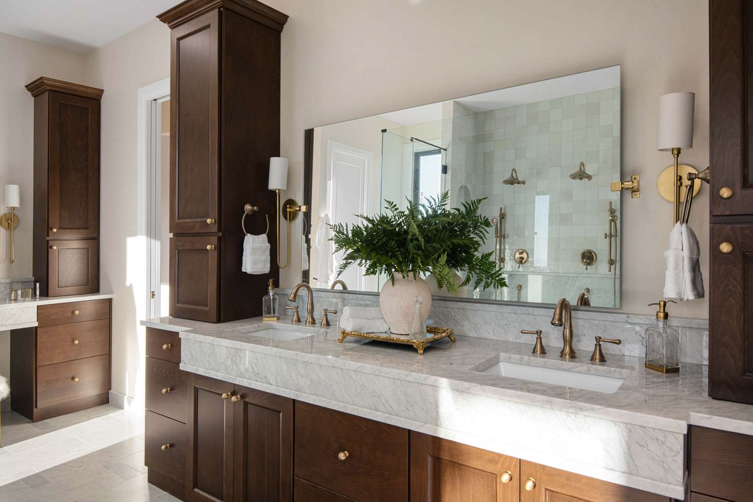 a bathroom with wood cabinets and stone counter