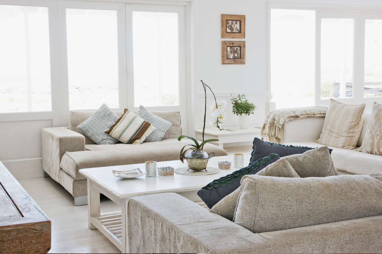 A living room with matching furniture arranged with a coffee table and cushions showcasing a clean and cohesive design