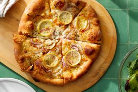 lemon cheese pizza on cutting board