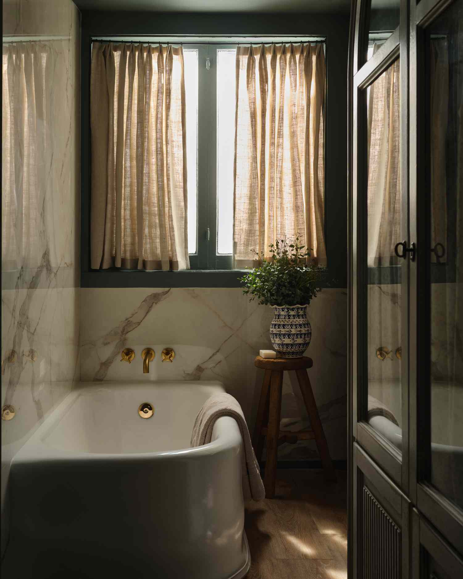 Freestanding Tub in an olive bathroom
