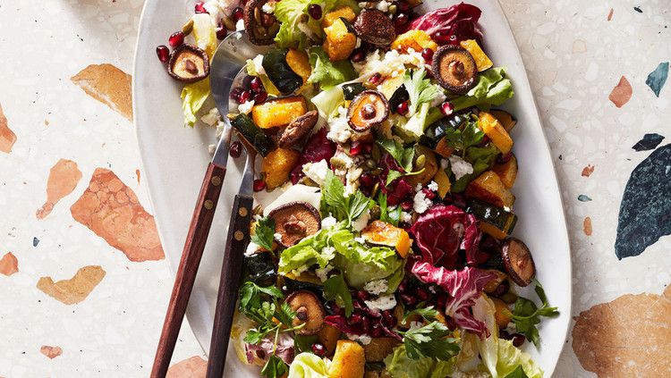 chopped winter salad with mushrooms and pomegranate