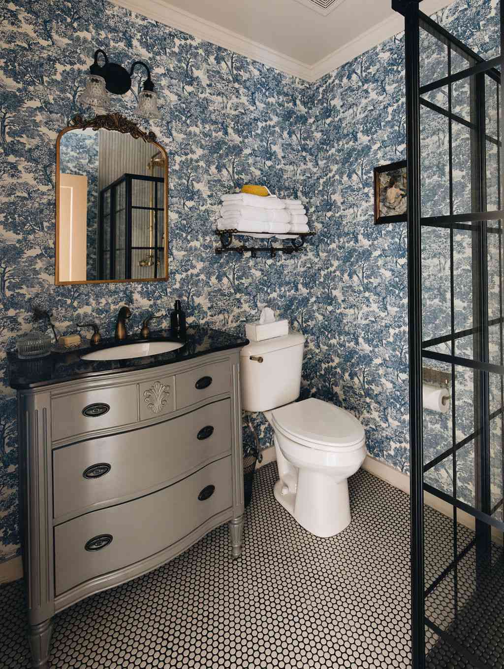 paire hospitality - bathroom with blue toile wallpaper and penny tile