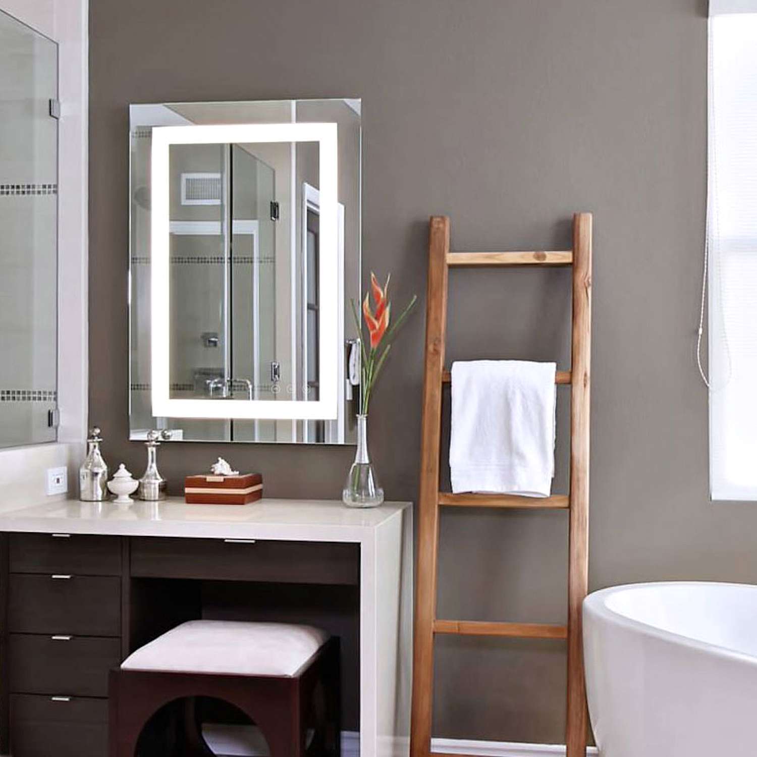 bathroom with LED lighted mirror over a vanity 