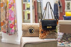 handbag and colorful textiles in a shop