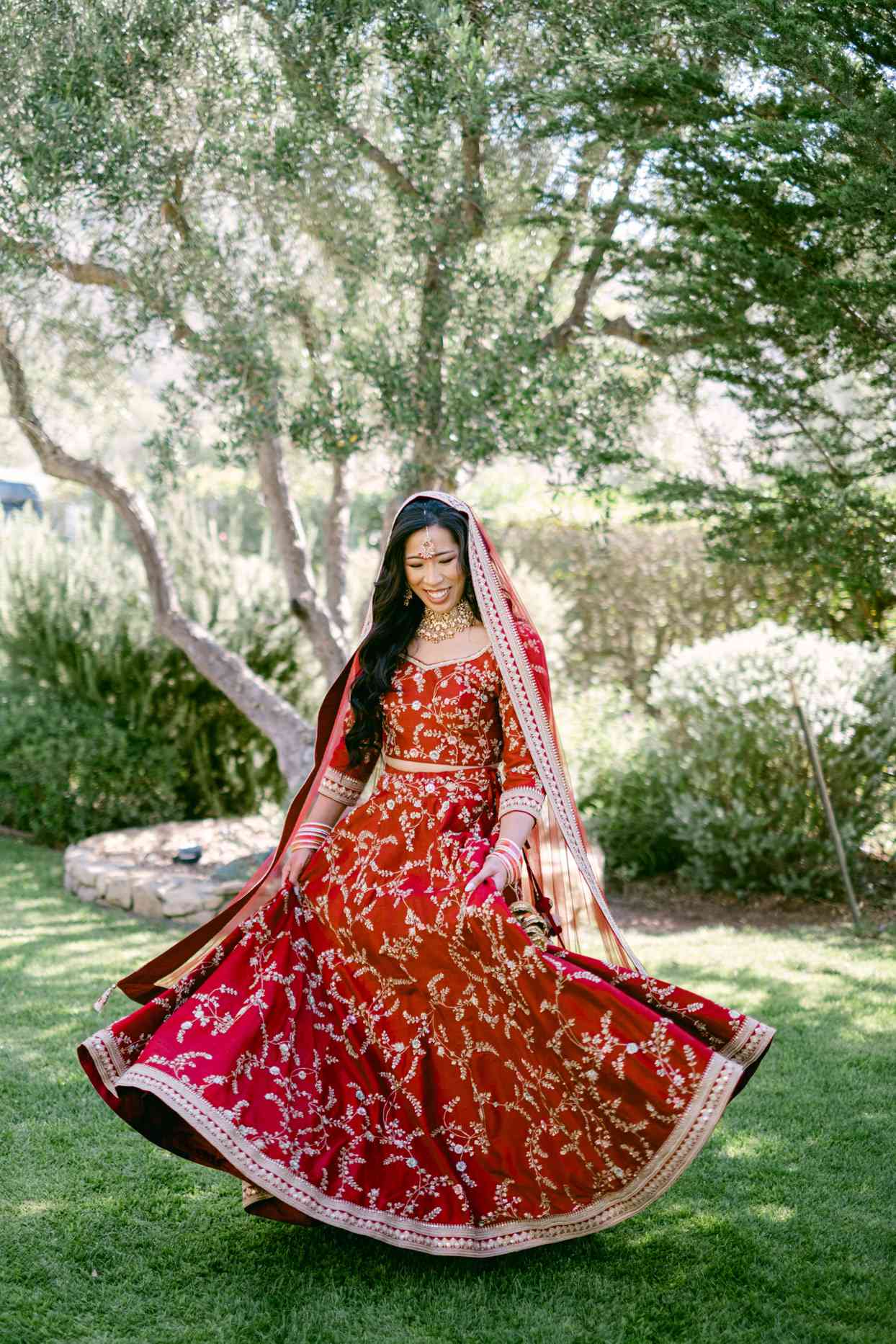 bride in red lehenga wedding dress