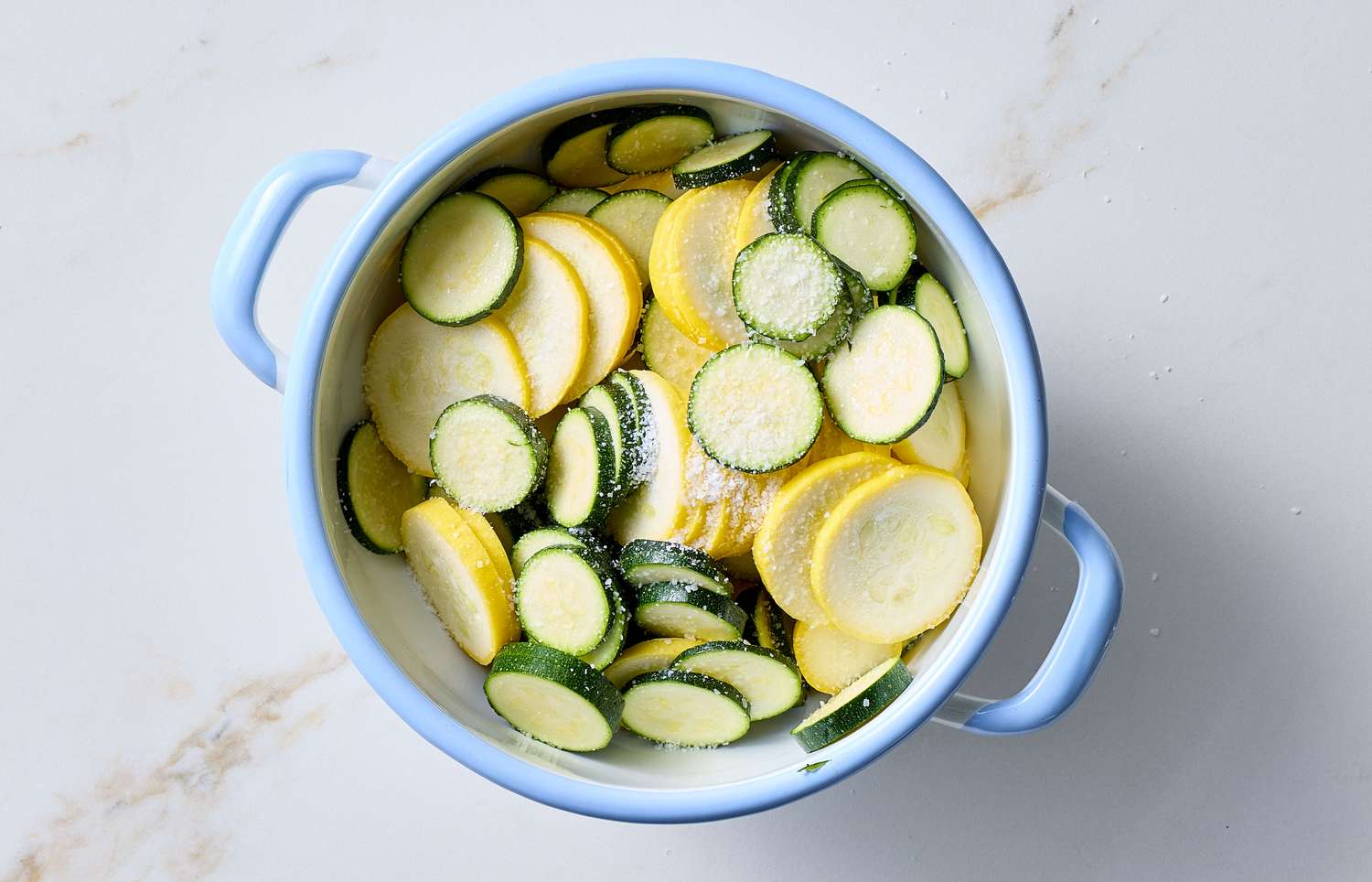 Sliced zucchini and squash in a pot prepared for cooking